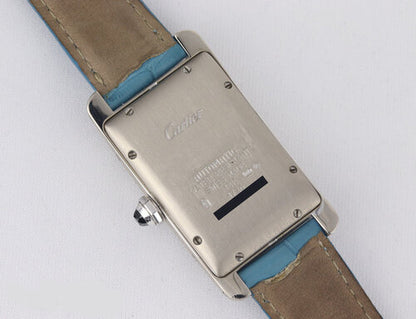 Cartier Tank Americaine Midsize 18ct White Gold 1726 Automatic, white guilloche dial, Roman numerals, blue steel hands, date indicator, sapphire crown, sapphire crystal, On a Cartier light blue strap with 18ct white gold buckle.