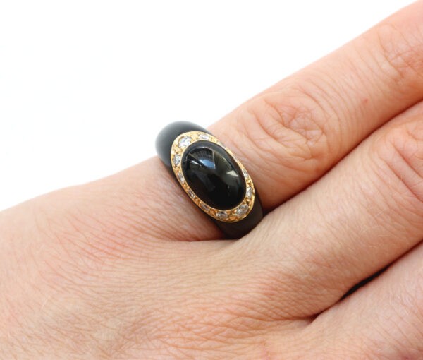 Van Cleef and Arpels Onyx, Diamond and 18ct Yellow Gold Fidji Ring; Signed and numbered Van Cleef & Arpels, Model Fidji, 0.51 carat total.