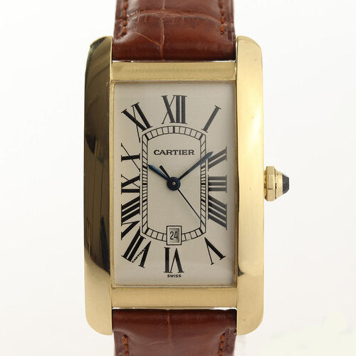 Cartier Tank Americaine Gents 18ct Yellow Gold Automatic, Ref 1740, white dial, Roman numerals, date indicator, blue steel hands, sapphire crown, sapphire crystal, on a Cartier brown leather strap with 18ct yellow gold pin buckle, with Cartier box and papers.