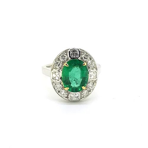 Emerald and Diamond Oval Cluster Ring; featuring a central 2.29 carat oval faceted emerald surrounded by 0.90cts asscher and brilliant-cut diamonds, in 18ct gold