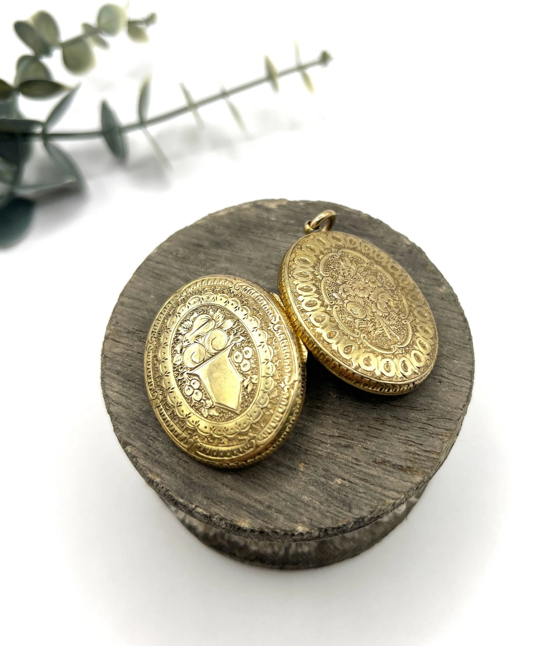 Early Victorian 15 Carat Yellow Gold Floral Engraved Oval Shaped Locket, Circa 1860
