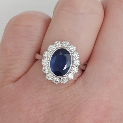 2.57ct Sapphire and Diamond Oval Cluster Engagement Ring