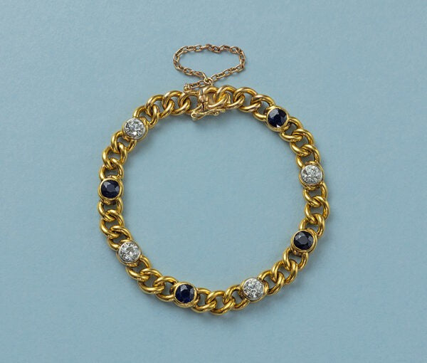 Antique French 18ct Yellow Gold Curb Link Bracelet with Diamonds and Sapphires; with 4 old-cut diamonds totalling 2.50cts and 4 round facetted blue sapphires totalling 3.92cts, Circa 1910