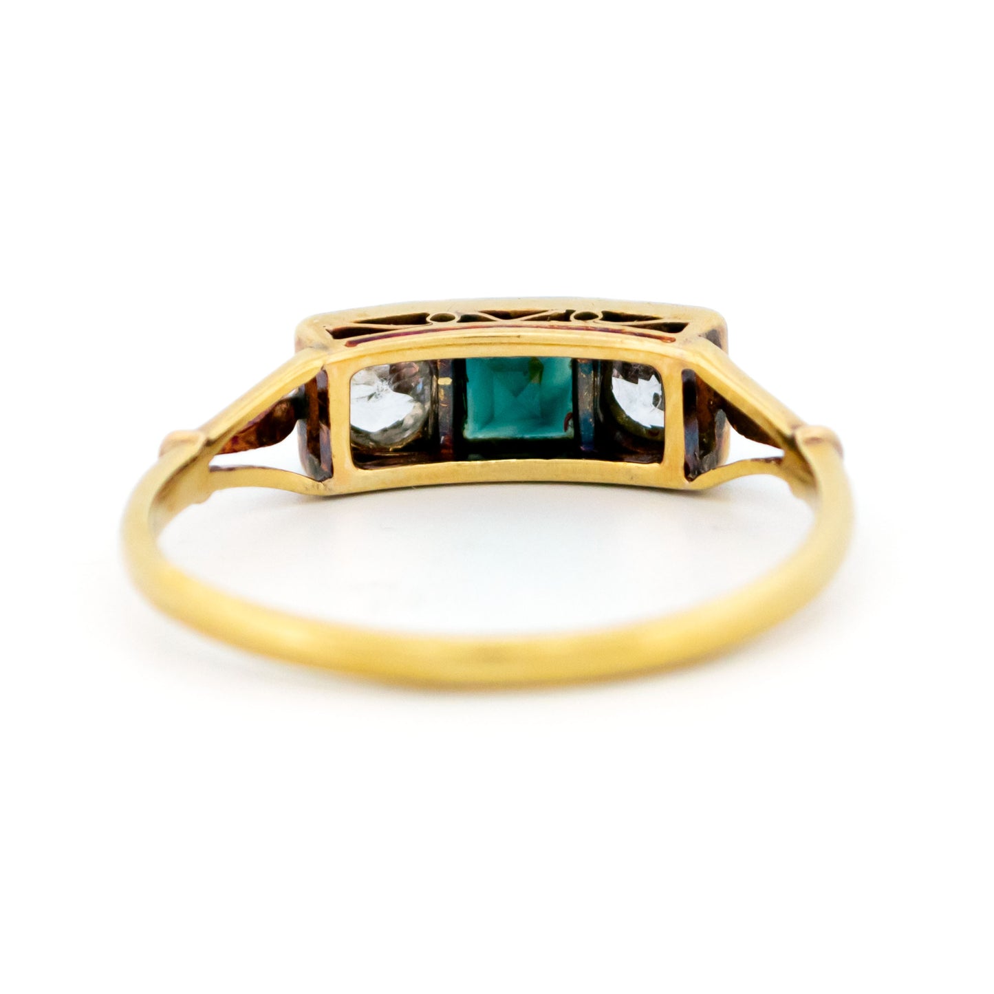 A three stone sapphire and diamond ring in yellow and white gold