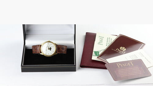 Piaget Triple Calendar Moon Phase 18ct Yellow Gold Limited Edition 33mm Watch, white dial, on brown leather strap with 18ct gold Piaget buckle. Ref. 15908, with Papers