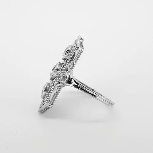 Belle Epoque Three Stone Diamond Plaque Ring; three central diamonds within an openwork platinum mount, diamond set shoulders, 1.50 carats