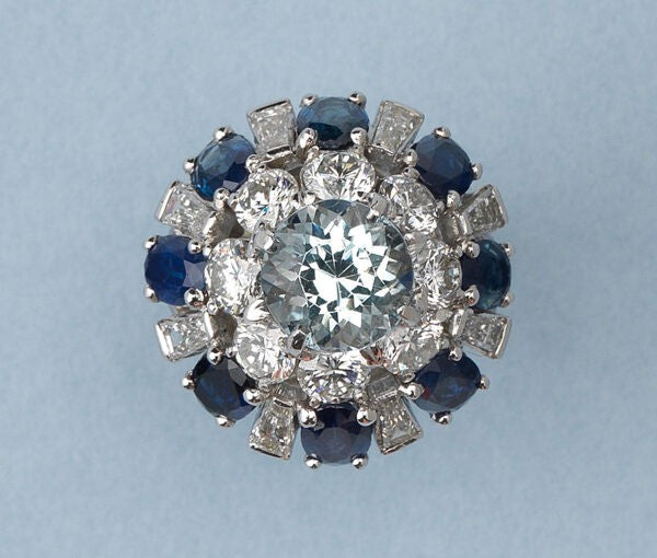 Vintage Aquamarine, Sapphire and Diamond Bombe Ring in Platinum; central 3.82ct round faceted light blue aquamarine surrounded by a double border of mixed-cut diamonds and sapphires, American, Circa 1950