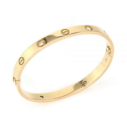 Cartier 18ct Rose Gold Love Bangle Bracelet set with four brilliant cut diamonds, Circa 2000s. Comes with Cartier box, gold screwdriver and certificate / insurance valuation from Cartier in Harrods London