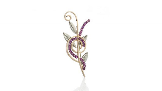 Tiffany and Co Vintage Ruby and Diamond Retro Floral Brooch, crafted from platinum and 14ct yellow gold, set with rubies and diamonds. USA, Circa 1940s