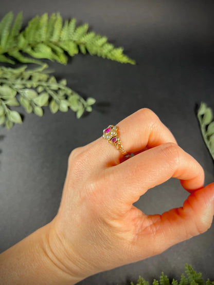A yellow gold ruby and pearl floral cluster ring, modelled on a hand