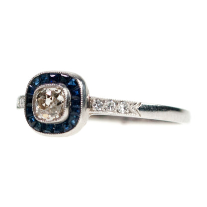 Platinum Cushion-Cut Diamond and Sapphire Halo Cluster Ring