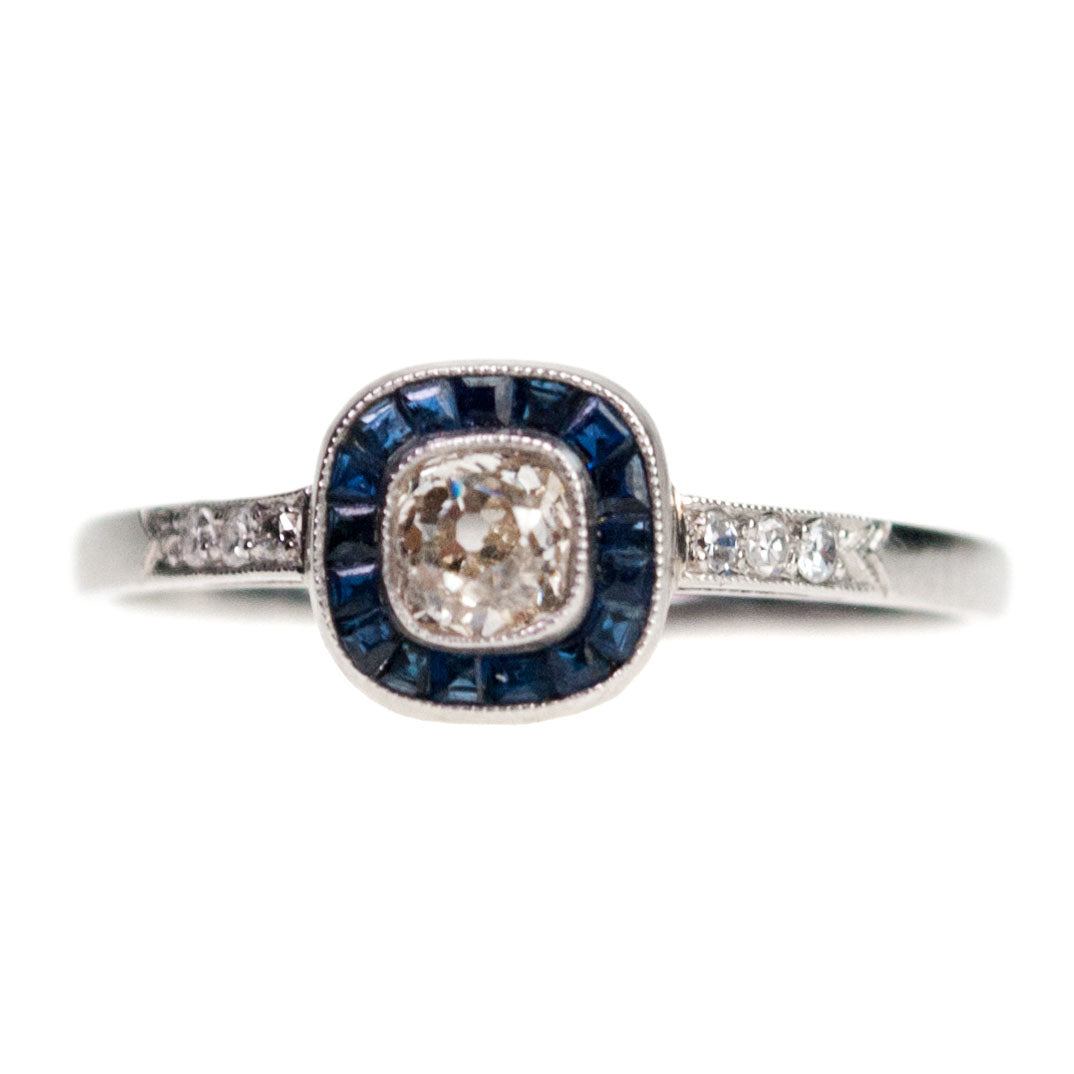 Platinum Cushion-Cut Diamond and Sapphire Halo Cluster Ring