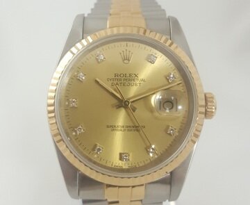 Rolex Datejust Steel and Gold 36mm Automatic with Original Diamond Dial and Box; with champagne dial, factory-set diamond hour markers, a magnified date aperture at the 3 o'clock position, screw-locked crown and quick set date, steel and gold Jubilee bracelet