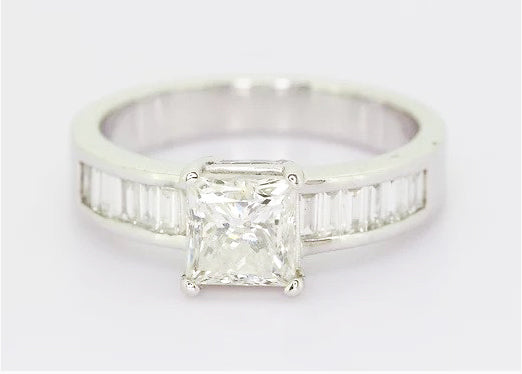 Princess Cut Diamond Engagement Ring; 1.70ct princess-cut diamond, four-claw set, accented with 0.57ct baguette-cut diamond set shoulders, 18ct white gold.