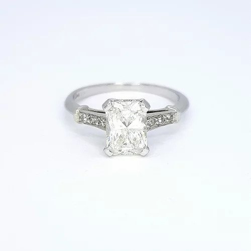 Radiant Cut Diamond Solitaire Engagement Ring; featuring a 1.18 carat radiant-cut diamond, accented with diamond set shoulders, in platinum