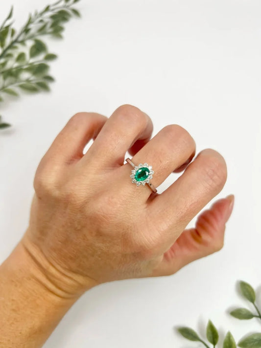 Emerald And Diamond Cluster Ring In 18 Carat White Gold