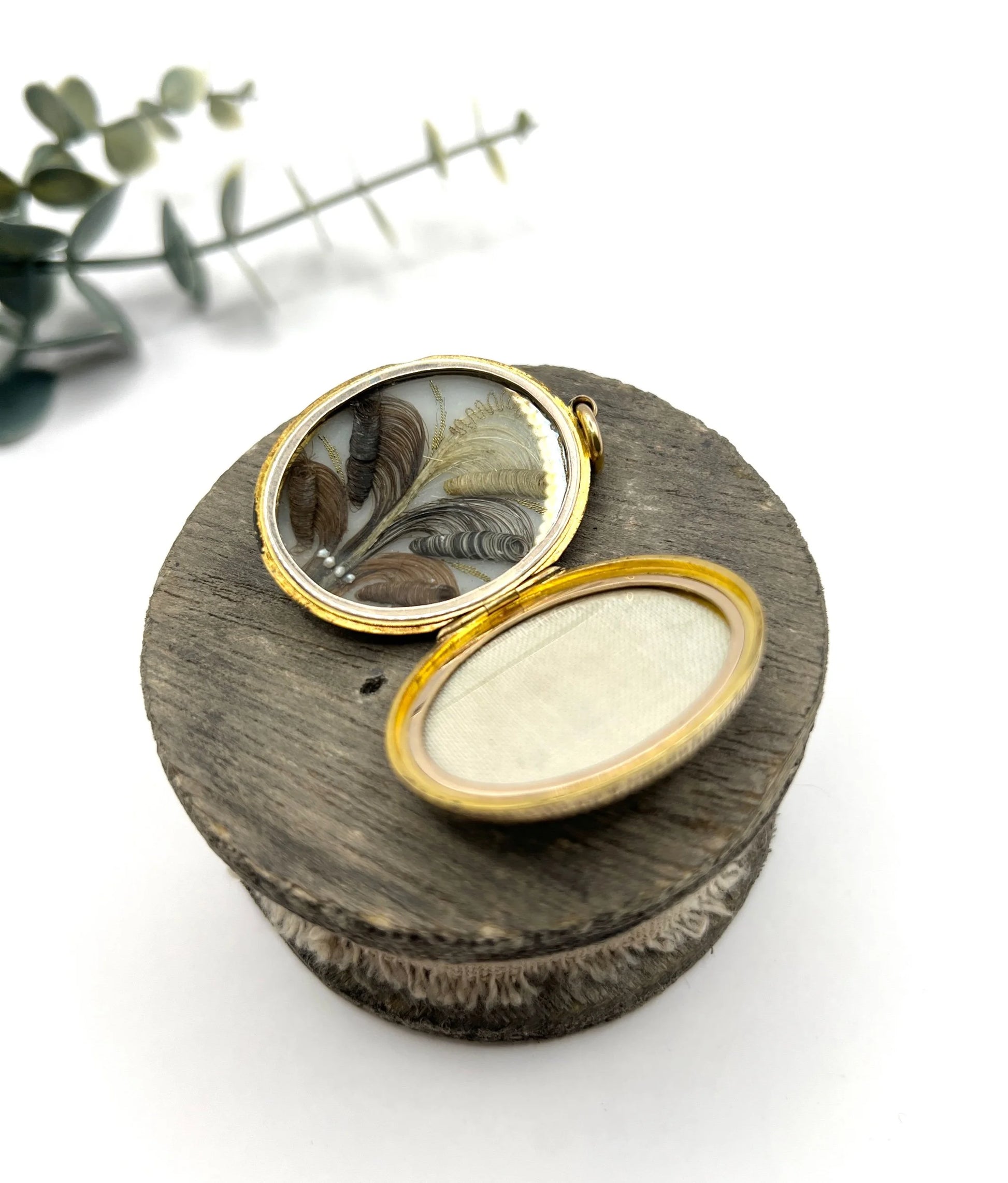 Early Victorian 15 Carat Yellow Gold Floral Engraved Oval Shaped Locket, Circa 1860