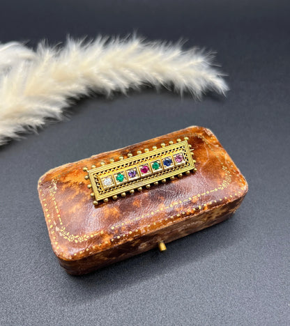 A yellow gold multi-gemstone and diamond acrostic brooch