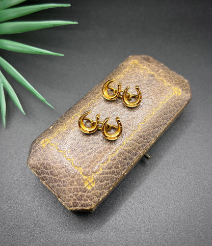 A pair of double-sided horseshoe cufflinks in yellow gold