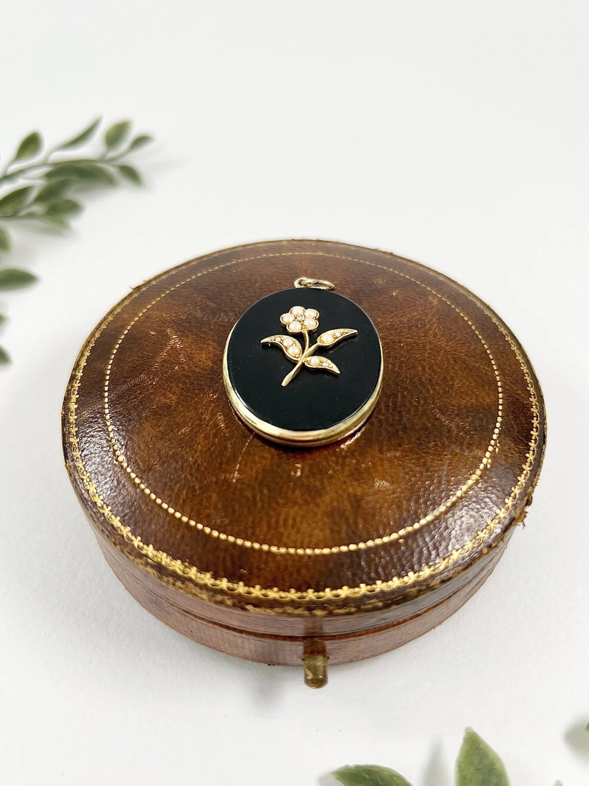 Edwardian 18 Carat Yellow Gold Onyx and Seed Pearl Flower Locket, Circa 1900