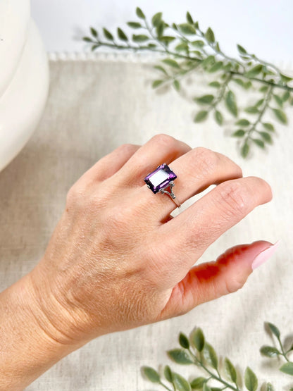 A solitaire amethyst cocktail ring in platinum, modelled on a hand