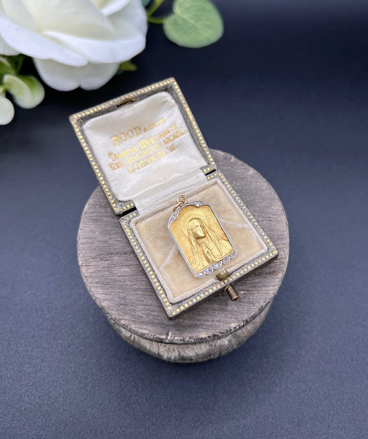 A yellow gold and platinum Madonna pendant with diamonds, in an antique box