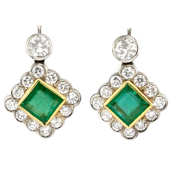Art Deco 3.54ct Colombian Emerald and 5.75ct Diamond Cluster Drop Earrings, 3.54cts square-shaped step-cut Colombian emeralds surrounded by early brilliant-cut diamonds suspended from old European-cut diamond solitaire tops in 18ct gold. Circa 1935