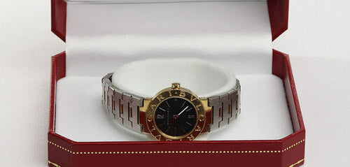 Bvlgari Ladies 18ct Yellow Gold and Steel 23mm Quartz Watch, on a steel and gold bracelet strap with fold over clasp