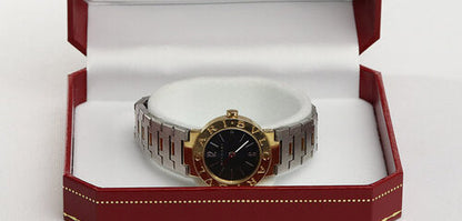 Bvlgari Ladies 18ct Yellow Gold and Steel 23mm Quartz Watch, on a steel and gold bracelet strap with fold over clasp