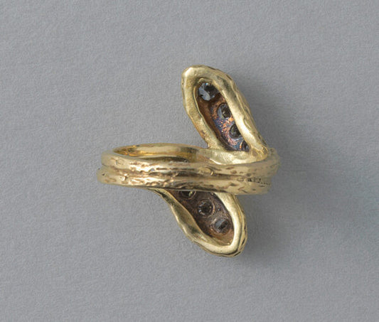 Vintage Diamond and 18ct Yellow Gold Snake Ring; two snake heads set with graduating brilliant diamonds, scaly structure to shank, France, Circa 1970. Attributed to Van Cleef & Arpels