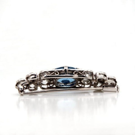Art Deco Aquamarine, Diamond and Platinum Brooch; vibrant blue oval-cut aquamarine surrounded by 2.50cts old-cut diamonds. Mounted in platinum.