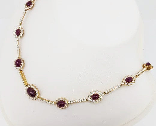 Natural Burma Ruby and Diamond Cluster Necklace; oval cabochon-cut natural Burmese rubies surrounded by diamonds, 15.00 carats, 18ct yellow gold, with certificate