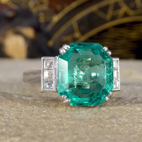 Certified 6.19ct Octagonal Cut Colombian Emerald and Princess Cut Diamond Ring in Platinum with GCS certificate