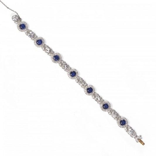 Belle Epoque Burmese Sapphire and Old Cut Diamond Bracelet in Platinum; comprised of round Burmese sapphire and diamond clusters, connected by diamond-set leaf motifs with a round old-cut diamond between each. Circa 1900. Sapphires 5.25 carats, Diamonds 9.50 carats
