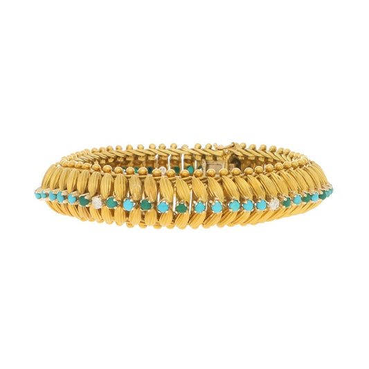 Vintage 1960s Yellow Gold Bracelet with Turquoise and Diamonds; handcrafted 18ct yellow gold bracelet with 3D textured leaf design and central row of cabochon turquoise alternating with 0.30cts round brilliant-cut diamonds, accented with borders of spherical gold beads