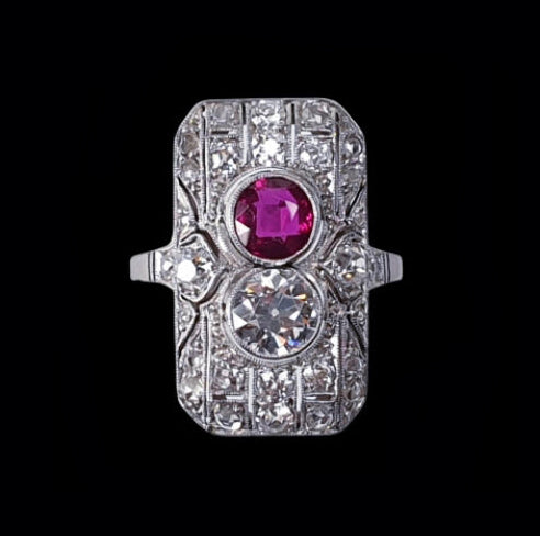 Art Deco Ruby and Diamond Plaque Ring; set with a vivid Ruby and sparkling Diamond to a fine rose-cut diamond-set pierced platinum mount