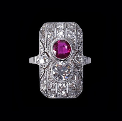 Art Deco Ruby and Diamond Plaque Ring; set with a vivid Ruby and sparkling Diamond to a fine rose-cut diamond-set pierced platinum mount