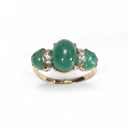 Vintage Cabochon Emerald and Diamond Three Stone Ring; central 2.80ct cabochon-cut emerald, flanked by fancy faceted emeralds and round brilliant-cut diamonds, claw set in yellow gold. Circa 1950