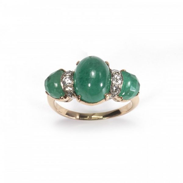 Vintage Cabochon Emerald and Diamond Three Stone Ring; central 2.80ct cabochon-cut emerald, flanked by fancy faceted emeralds and round brilliant-cut diamonds, claw set in yellow gold. Circa 1950