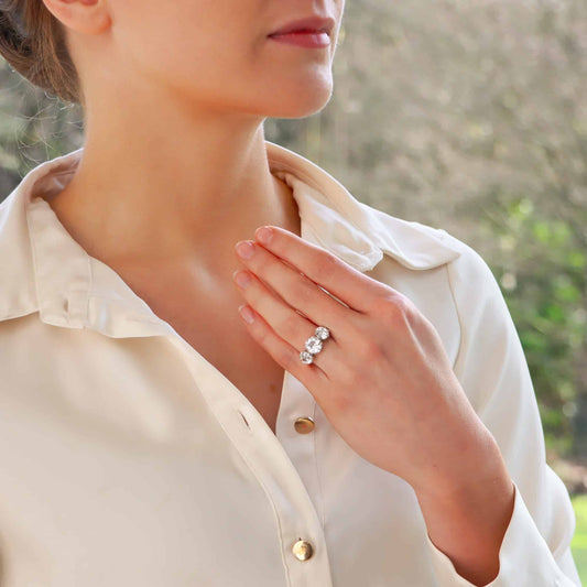 Vintage old mine cut 2.30 diamond three stone ring set in platinum.