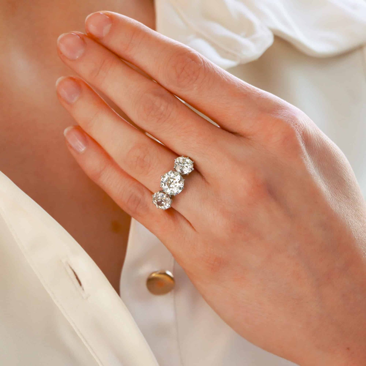 Vintage old mine cut 2.30 diamond three stone ring set in platinum.