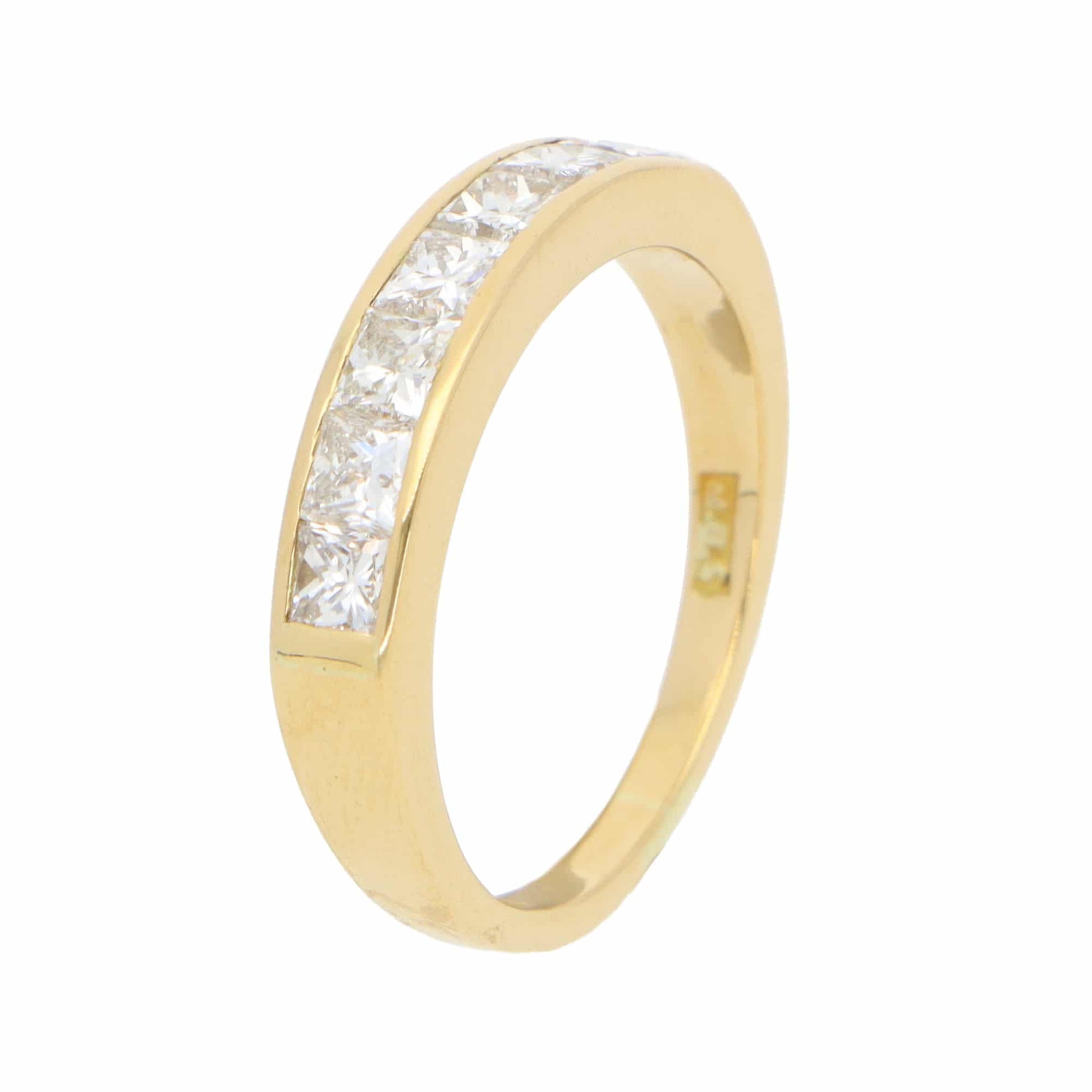 A yellow gold half eternity band ring with princess cut diamonds, on a white background