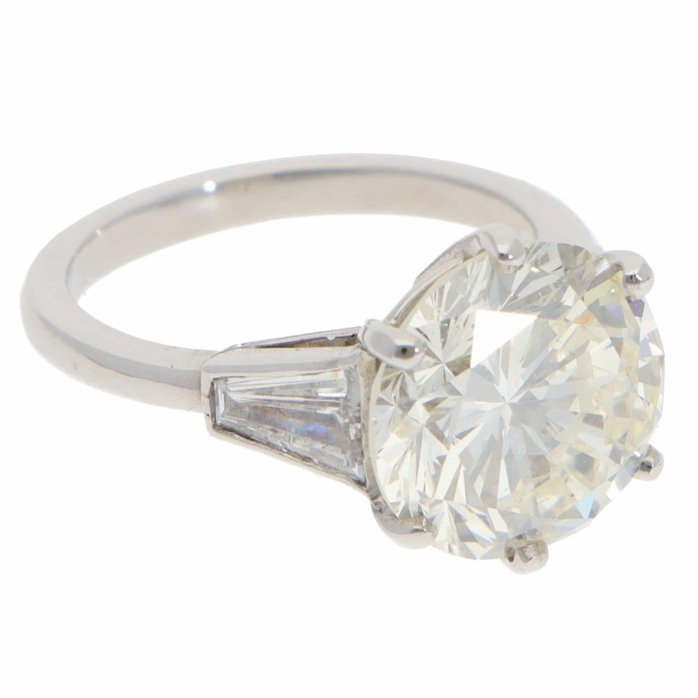 Vintage 6.03 Carat GIA Certified Diamond Three Stone Ring In Platinum