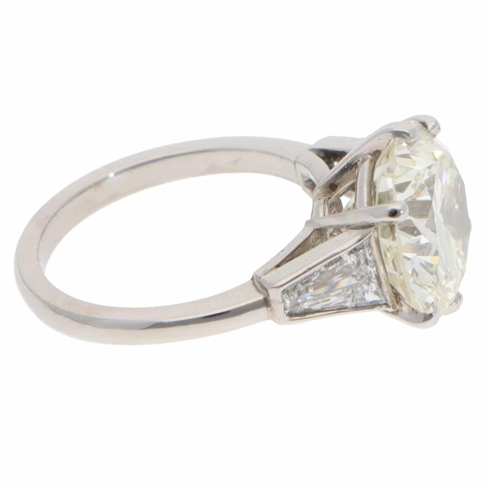 Vintage 6.03 Carat GIA Certified Diamond Three Stone Ring In Platinum