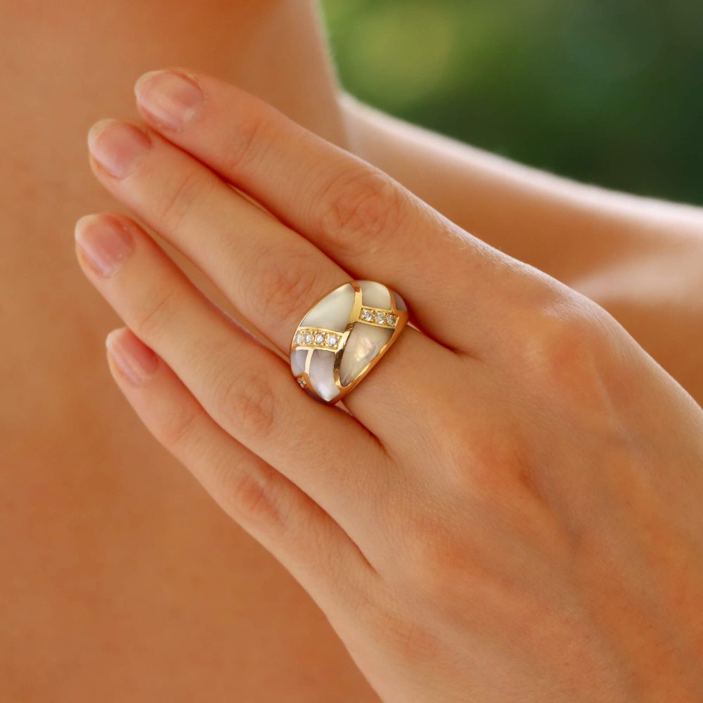 Vintage mother of pearl and diamond bombé ring in yellow gold.
