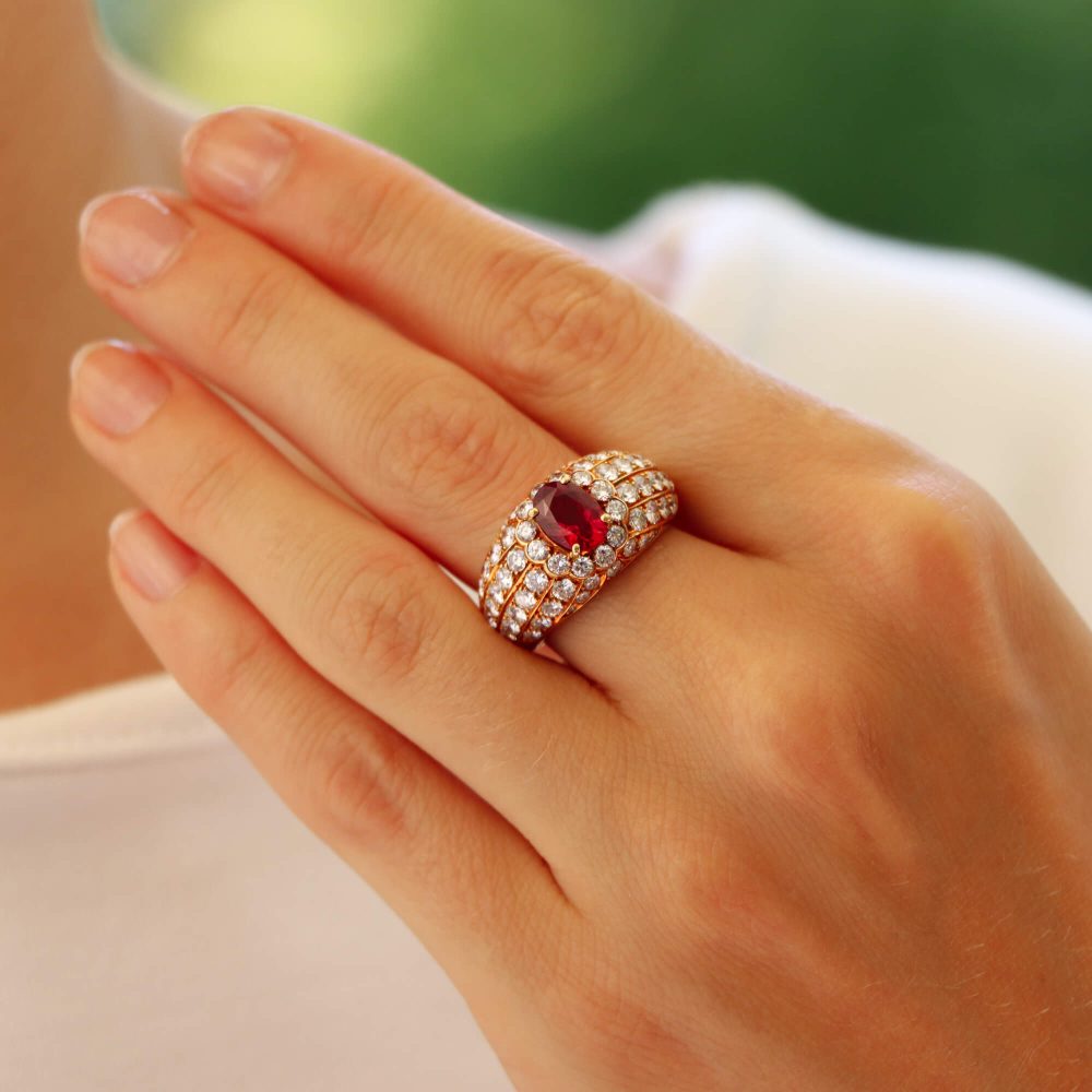 Vintage ruby and diamond cluster bombe ring in yellow gold.
