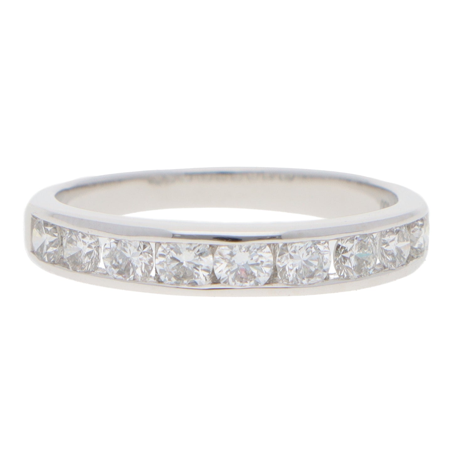 A brilliant cut diamond channel set half eternity band ring, on a white background