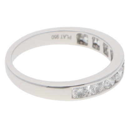 A brilliant cut diamond channel set half eternity band ring, stamped PLAT 950, on a white background