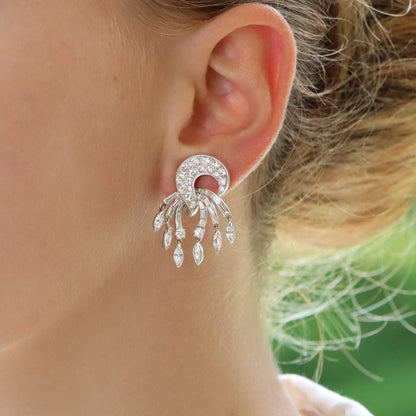 Diamond drop clip-on earrings set in platinum and gold.