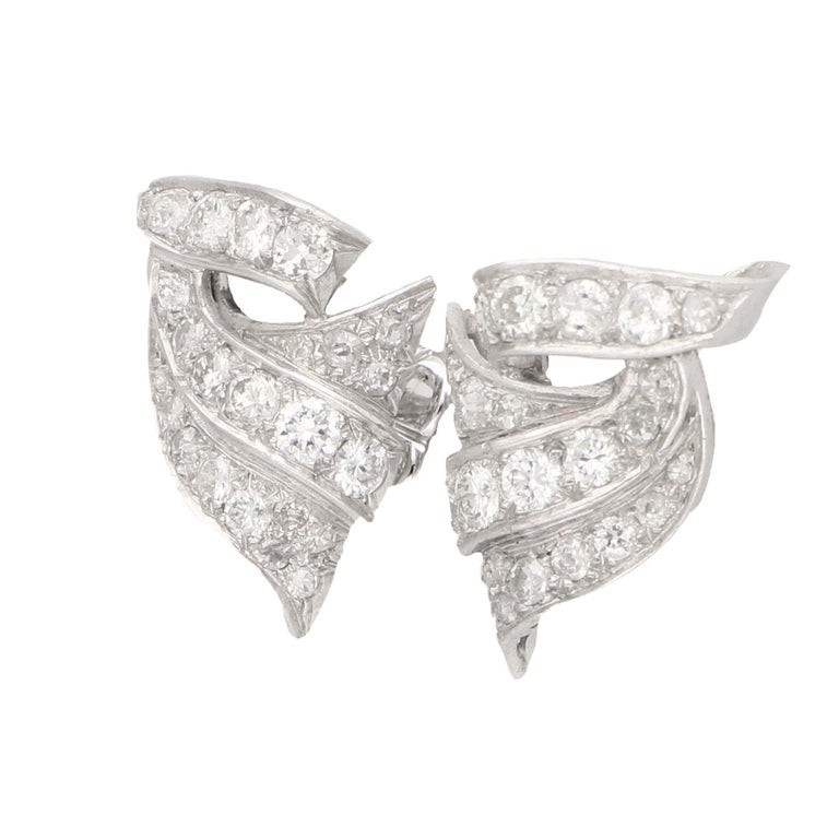 Diamond scroll earrings set in platinum